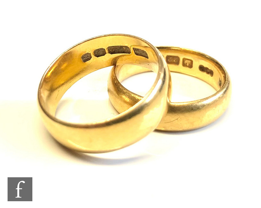 Two 22ct hallmarked D shaped wedding rings of plain form, total weight 13g, one dated Birmingham
