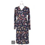 A 1930s ladies vintage dress in deep blue silk with a printed pink, purple and yellow floral