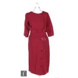 A 1940s/50s ladies vintage dress in maroon/burgundy heavy crepe with sash and satin bow detail