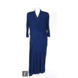 A 1940s ladies vintage dress in deep blue lurex with pleated cross body details, to a midi skirt,