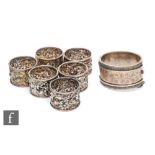A set of six hallmarked silver circular napkin rings each with foliate embossed decoration,