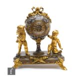 A late 19th Century French champlevé enamelled time piece with spring driven movement, the balloon