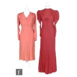 A 1930s ladies vintage evening dress in deep red chiffon, with high neck and bow decoration to the