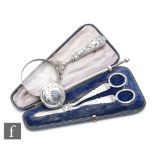 A collection of silver items to include a pair of Edward VII cased grape scissors, Sheffield 1902,