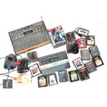 A collection of retro gaming items, to include an Atari 2600, various games including Slot Racers,