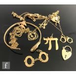 A small parcel lot of assorted 9ct jewellery items to include pendant modelled as cufflinks, a