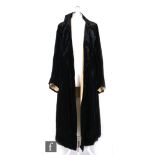 A 1930s ladies vintage black velvet coat labelled M & E Abbott, 65 Hagley Road, Edgbaston, the