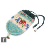 A vintage lady's beadwork purse, with beadwork tassels to the lower section with embroidered