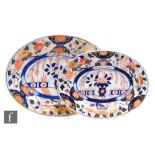 Two graduated 19th Century Chinoiserie meat plates decorated in the Imari palette, both unmarked,