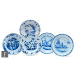 Three assorted 19th Century tin glazed plates decorated in blue and white with Chinoiserie roundels,