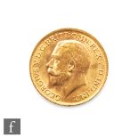 A George V full sovereign dated 1915.