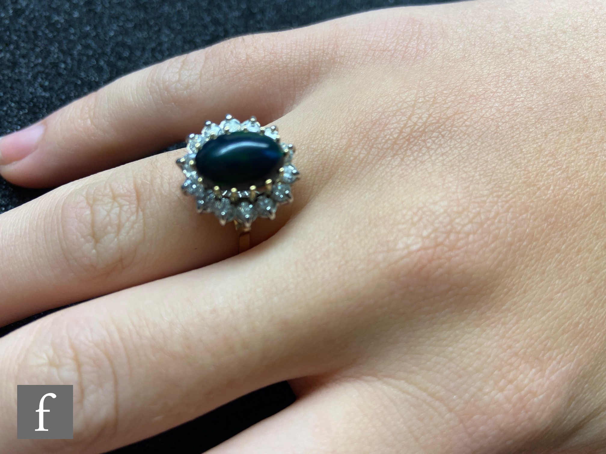 A 9ct hallmarked black opal and diamond cluster ring, central oval opal, length 11mm, within a - Image 6 of 7