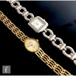 A 9ct gold lady's Sovereign wristwatch on a yellow gold gate bracelet, engraved to reverse, together