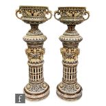 A pair of 19th Century German stoneware jardiniere and pedestal stands, each jardiniere of campana