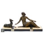 A 20th Century patinated spelter study, depicting a seated nude female figure reaching out to a