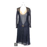A 1920/30s ladies vintage dress in deep blue and gold chiffon with a blue lace overlay, with tapered