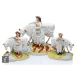 A 19th Century garniture of Staffordshire figures comprising a large central model of a milkmaid
