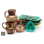 A collection of ceramics to include a selection of leaf form dishes by Wedgwood, salt glazed jugs