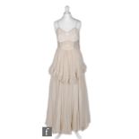 A 1930s ladies vintage Roecliff & Chapman evening dress in an off white chiffon, the bodice with a