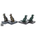 A pair of 20th Century spelter bookends, depicting green painted stylised seated retrievers, mounted