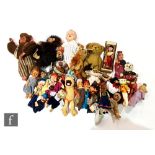 A collection of assorted dolls, teddy bears and puppets, to include various hand puppets and three