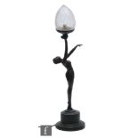 Crosa - A later 20th Century table lamp in the Art Deco style, resin in bronzed finish, formed as