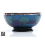William Moorcroft - A high sided bowl decorated in the Moonlit Blue pattern with trees to the