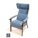 Parker Knoll - A 1960s wing armchair in blue cloth upholstery. NB - This chair is offered for sale