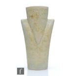 Chris Carter - A studio pottery vessel of triangular shaped form glazed in a pale oatmeal, seal mark