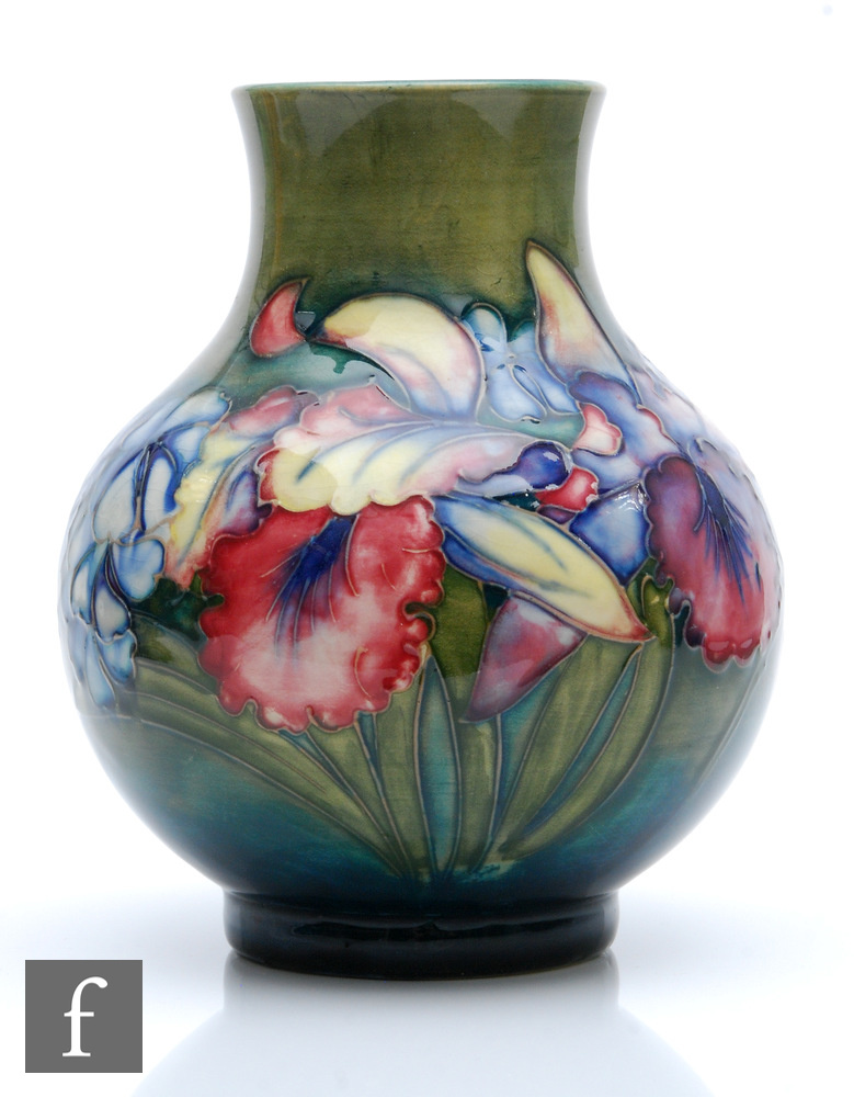 William Moorcroft - A vase of globe and shaft form decorated in the Frilled Orchid pattern with