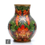 Philip Gibson - Moorcroft Pottery - A baluster vase decorated in the Flame of the Forest pattern,