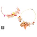 Unknown - Two vintage plastic beaded necklaces each with pale pink, yellow and red flowers,