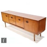 Nathan Furniture - A teak Corinthian sideboard, fitted with a central bank of three drawers and a