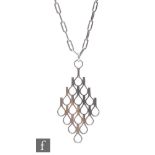 Jack Spencer - A modernist silver pendant on a chain, the lozenge shaped pendant with an open work