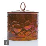 Newlyn - An early 20th Century Arts and Crafts copper tea caddy of oval form decorated with