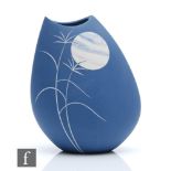 Sue Dyer - A contemporary studio pottery vase of compressed form decorated with incised grasses in