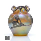 Loetz - An early 20th Century glass vase of dimpled shouldered ovoid form with an everted and folded