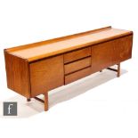 White and Newton - A Petersfield teak sideboard, with concave ledge back above an arrangement of