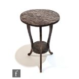 Liberty & Co - An Aesthetic style foliate carved softwood occasional table of circular form,