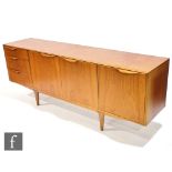 Tom Robertson - McIntosh of Kirkcaldy - A teak Dunvegan sideboard, fitted with a central double door