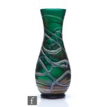Kralik - An early 20th Century glass vase of footed swollen ovoid form with flared collar neck,