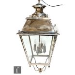 Unknown - A contemporary lantern style chandelier, the chrome metalwork suspended from a knopped