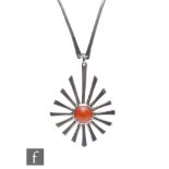 Unknown - A modernist pendant formed as an abstract sunburst with inset orange cabuchon, all to a