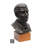 Elizabeth Foster late 20th century - A bronze bust of a smiling elderly gentleman wearing a