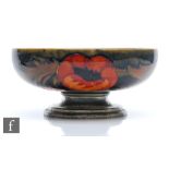 William Moorcroft - Liberty & Co - A pedestal bowl decorated in the Big Poppy pattern with flowers