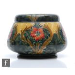 William Moorcroft - James Macintyre & Co - An early 20th Century tobacco jar and cover decorated