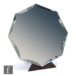 Unknown - A 1930s Art Deco octagonal mirror with bevelled edges affixed to a wooden easel back,