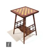 In the manner of Liberty and Co - A Moorish style walnut games table, the tiled chequerboard top
