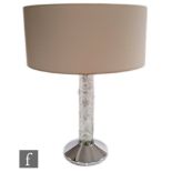 Lalique - A contemporary Lalique table lamp titled Faunes, the chromed conical base mounted with a