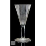 A large 19th Century drinking glass in the 18th Century taste, the conical bowl above a plain stem